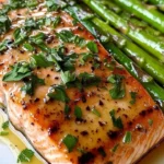 Deliciously garnished garlic butter salmon fillet on a plate