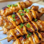 Delicious Bang Bang Chicken Skewers garnished and ready to serve