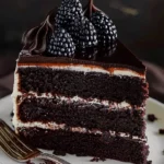 Delicious slice of Black Velvet Cake with cream cheese frosting on a plate