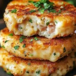Delicious cheesy tuna melt patties served with a side salad