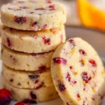 Citrus-Kissed Shortbread Coins on a plate, perfect buttery treats.