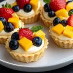 Creamy mini fruit tarts topped with fresh fruits