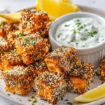 Crispy salmon cubes with everything crust served with oniony dip