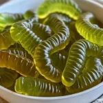 Colorful Dill Pickle Gummy Worms in a bowl