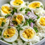 Egg salad with cottage cheese and herbs served in a bowl