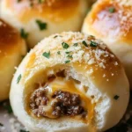 Garlic Parmesan Cheeseburger Bombs served on a wooden board.