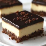 Slice of Grandma Jean's 3-Layer Dream dessert showcasing its rich, layered texture.