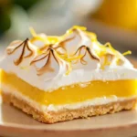 Lemon meringue tart bars with a golden meringue topping and lemon filling