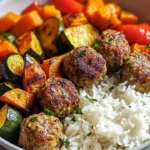 Plate of meatballs with roasted vegetables and rice for a healthy meal