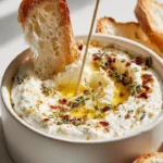 Melting candle ricotta dip with herb-garlic butter drizzling on top