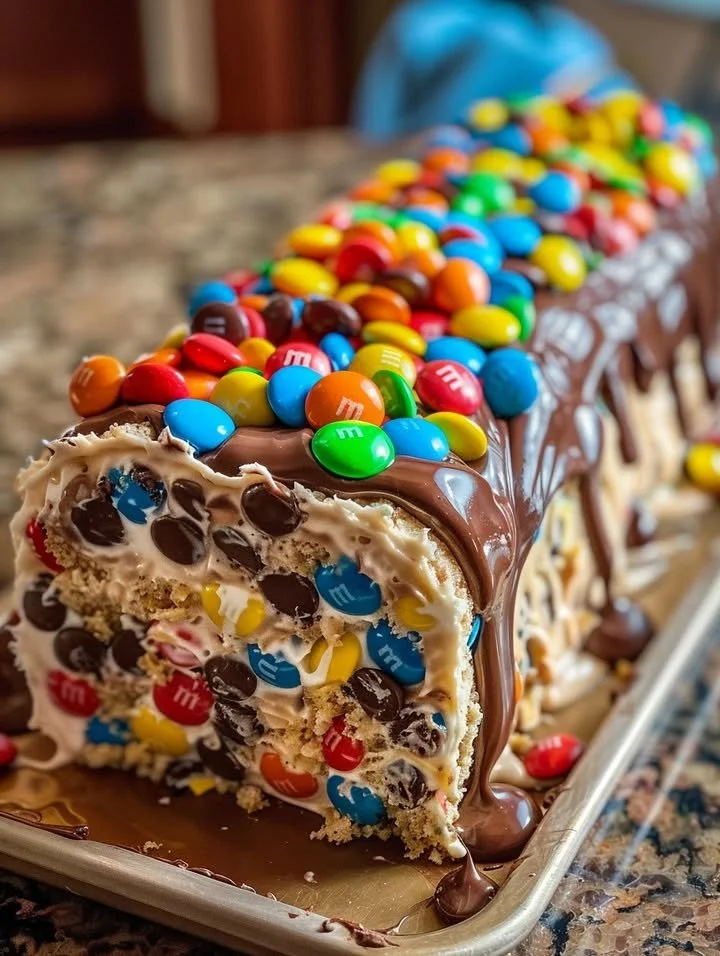 M&M's Chocolate Chip Cookie Dough Ice Cream Cake Roll with colorful toppings