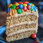 Delicious M&M's peanut butter cake with creamy peanut butter frosting