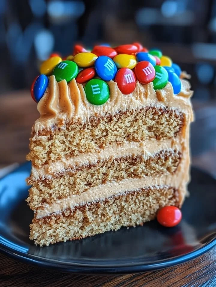 Delicious M&M's peanut butter cake with creamy peanut butter frosting