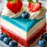 Delicious no bake patriotic cheesecake topped with red, white, and blue berries