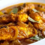 Delicious pickled fish served with caramelized onions on a platter