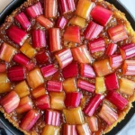 Delicious Rhubarb Upside-Down Cake topped with fresh rhubarb slices