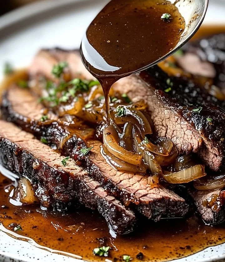Slow cooker brisket with balsamic onion gravy served on a plate