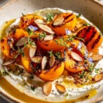 Plate of smoky stone fruit with herbed cheese for a delightful appetizer