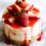 Delicious Strawberry Shortcake Cheesecake with fresh strawberries and cream