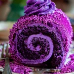 Delicious purple velvet cake roll with cream cheese filling on a rustic background