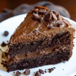 Delicious triple chocolate cake slice with rich chocolate frosting and decorations