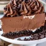 Delicious triple chocolate cheesecake topped with chocolate shavings