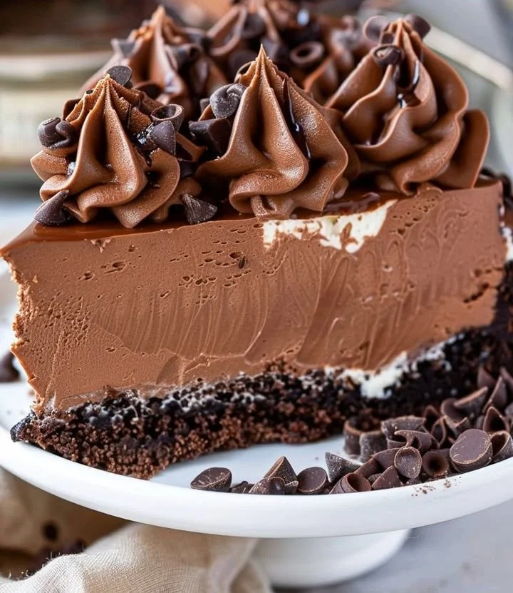 Delicious triple chocolate cheesecake topped with chocolate shavings