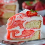 Velvet Lemon Cream Cake with Strawberry Swirl garnished with fresh strawberries