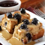Wild Berry Bread Pudding topped with rich Orange Sauce ready to serve