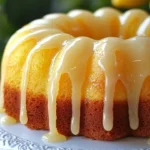 Deliciously zesty glazed lemon bundt cake with a slice cut out.
